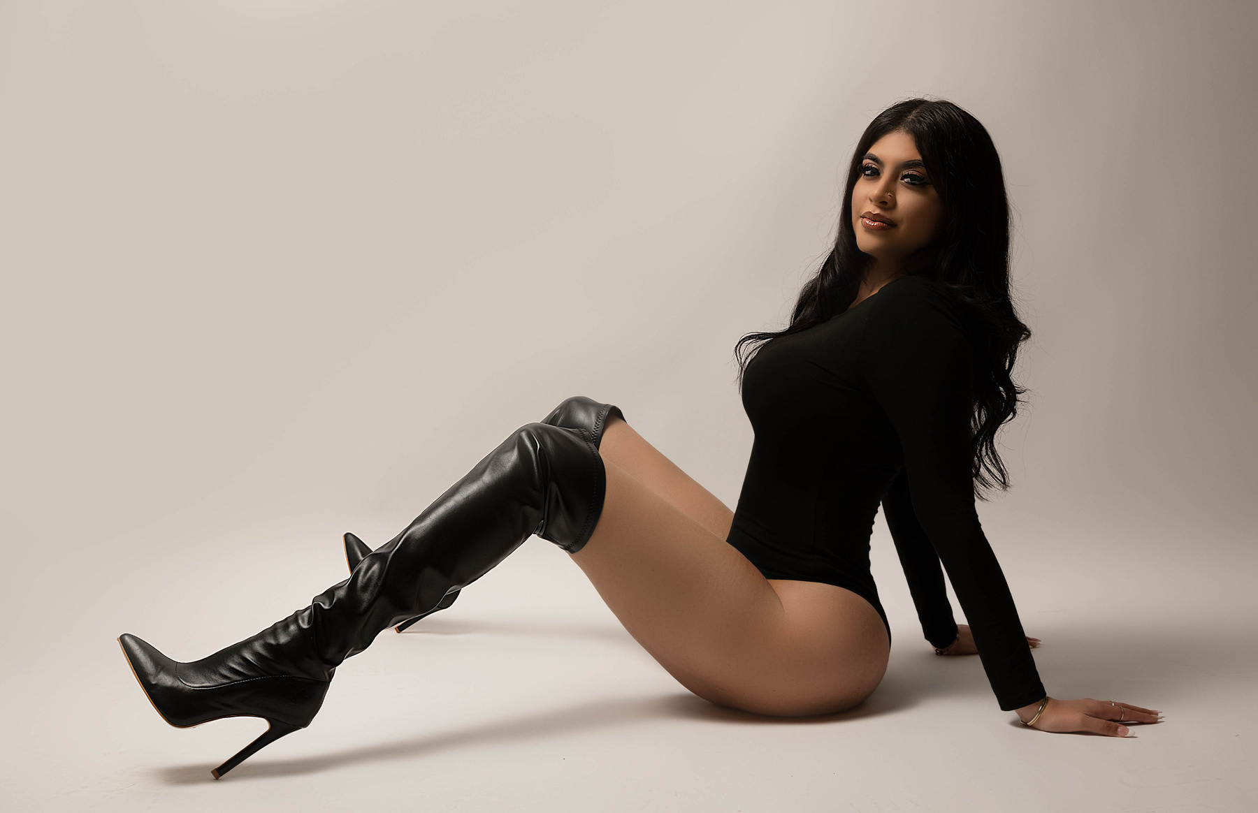 adult birthday photoshoot taken by Aly incardona who is an award winning photographer in the Central Valley California based out of modesto . This shoot was taken wearing a black bodysuit, black long high boots and black hair with high end retouchin